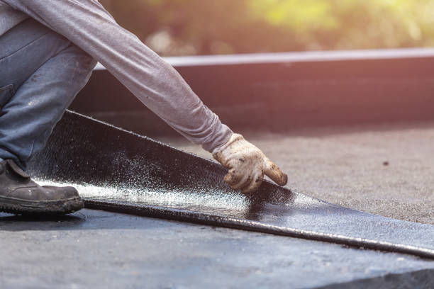 Professional Waterproofing technician working in Raymond, IL